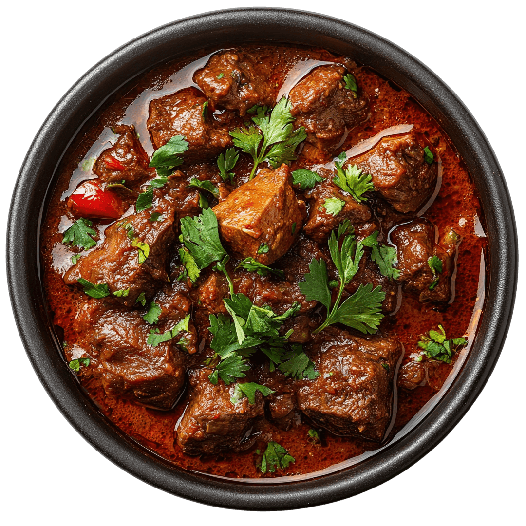 Lamb Curries Authentic Chicken Tikka Masala served in a royal copper bowl at Delhi Darbar restaurant